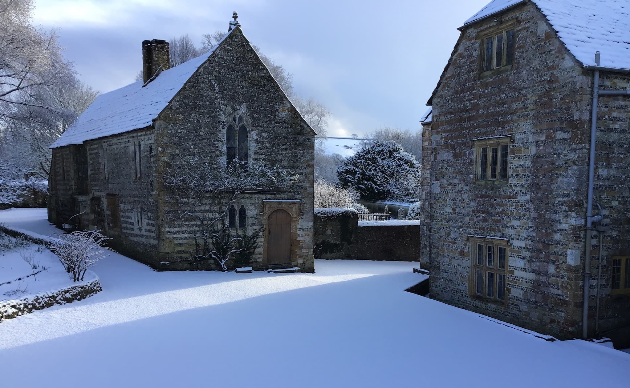 The historic grounds of Cerne Abbey, home to the medieval Guest House, Dorset
